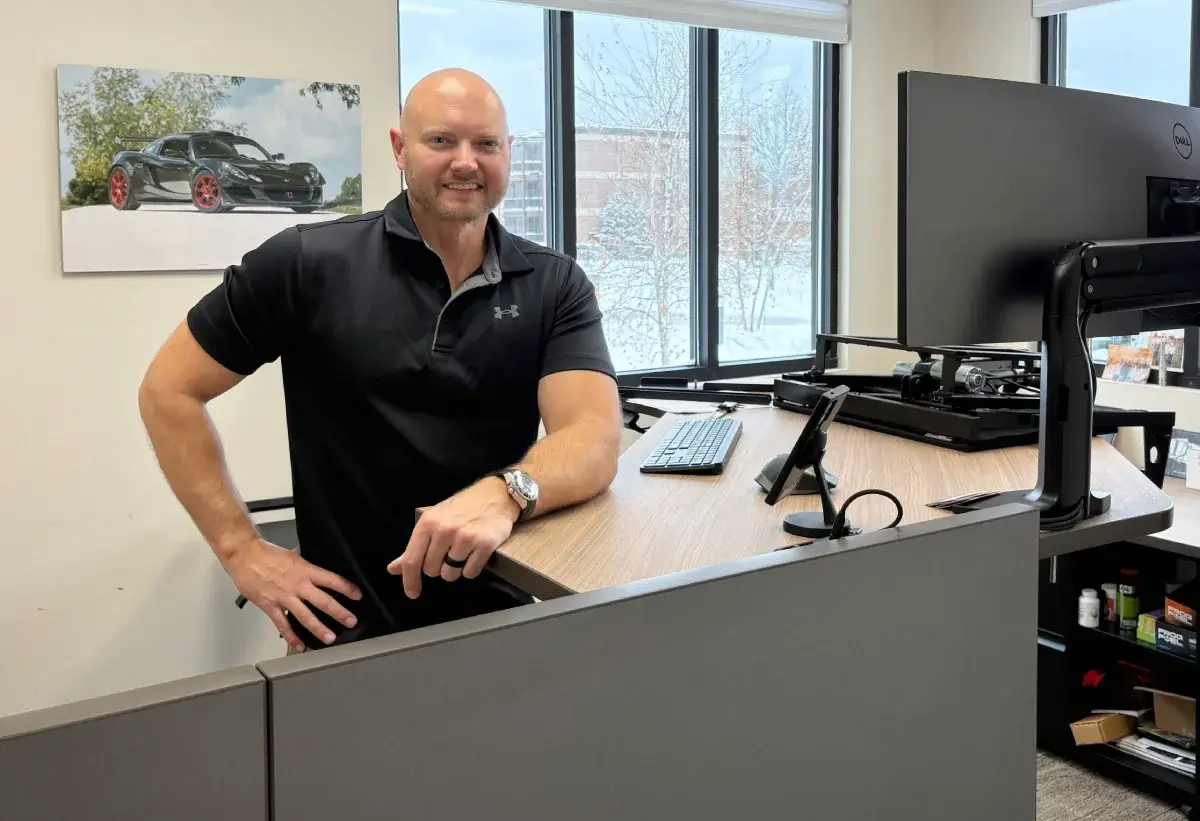 Robert Kearns III, President of C2S, at his desk. C2S provides mechanical design, precision assemblies, and engineering optimization services.